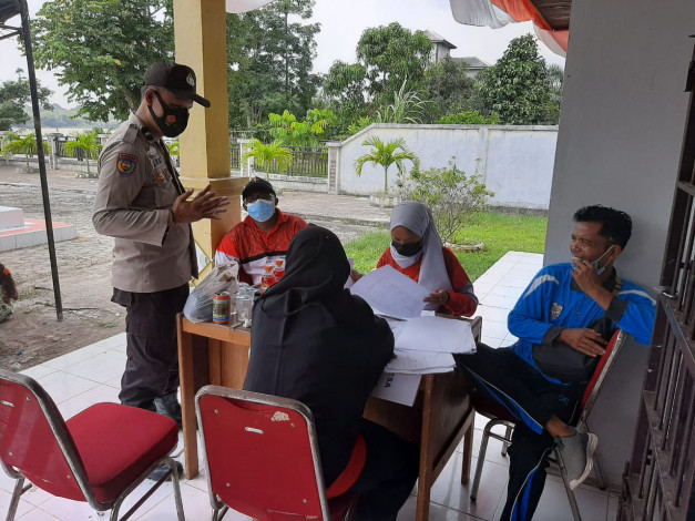 Polsek Teluk Meranti Kembali Lakukan Pengamanan Vaksinasi di Desa Kuala Panduk