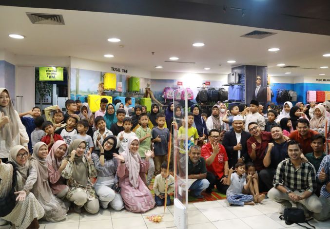 Riau Petroleum Ajak Anak Yatim Piatu dan Dhuafa Belanjo Baju Rayo