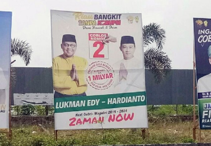 Baliho LE-Hardianto yang Dipasang KPU Riau Tanpa Lambang Partai Pengusung