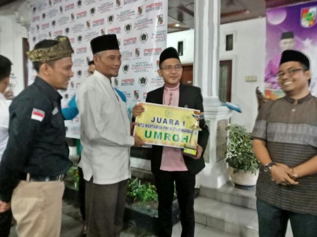 Juara 1 MTQ Wartawan,  Rizal Raih Hadiah Umrah